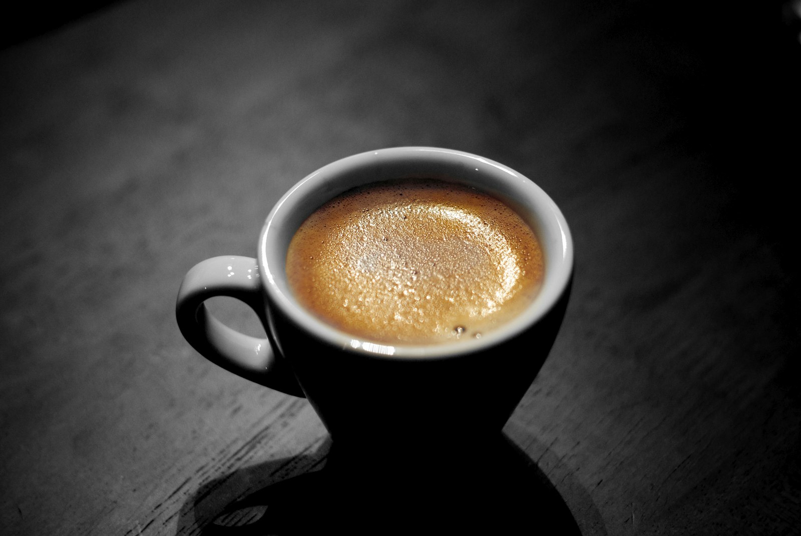 An espresso in a black cup
