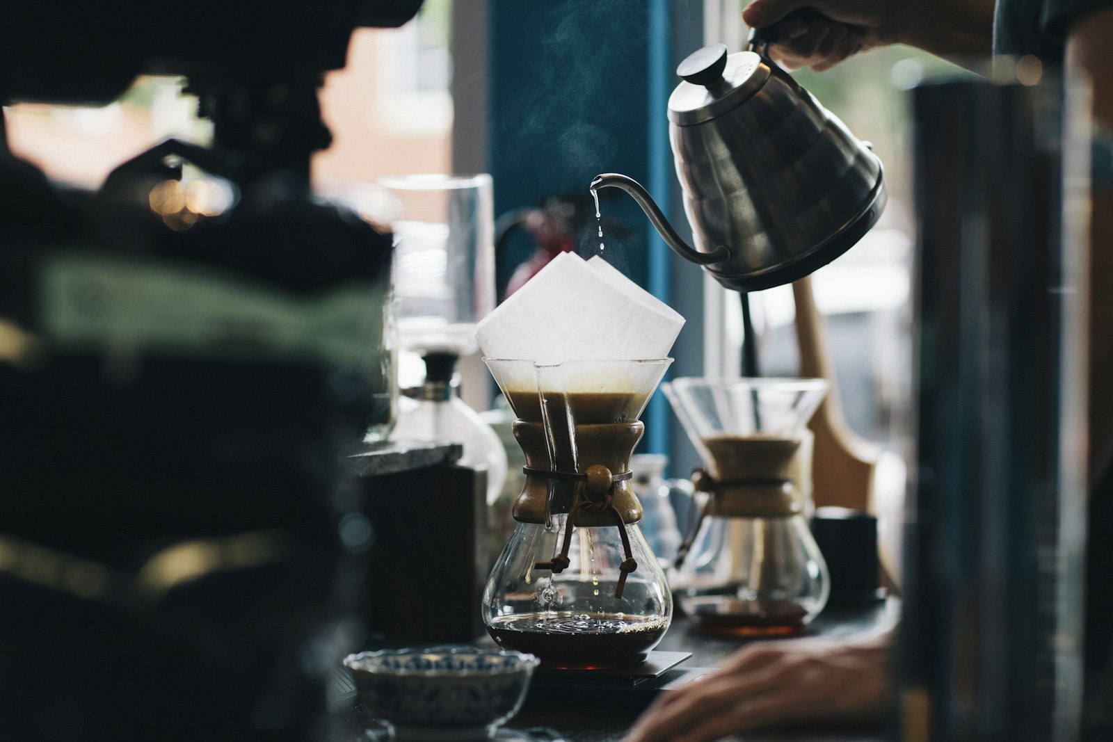 Pour over coffee brewing at a bar