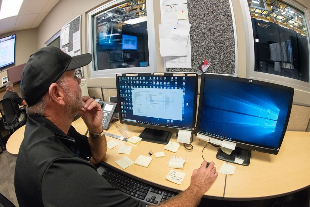 An operator watching edge traffic on two screens