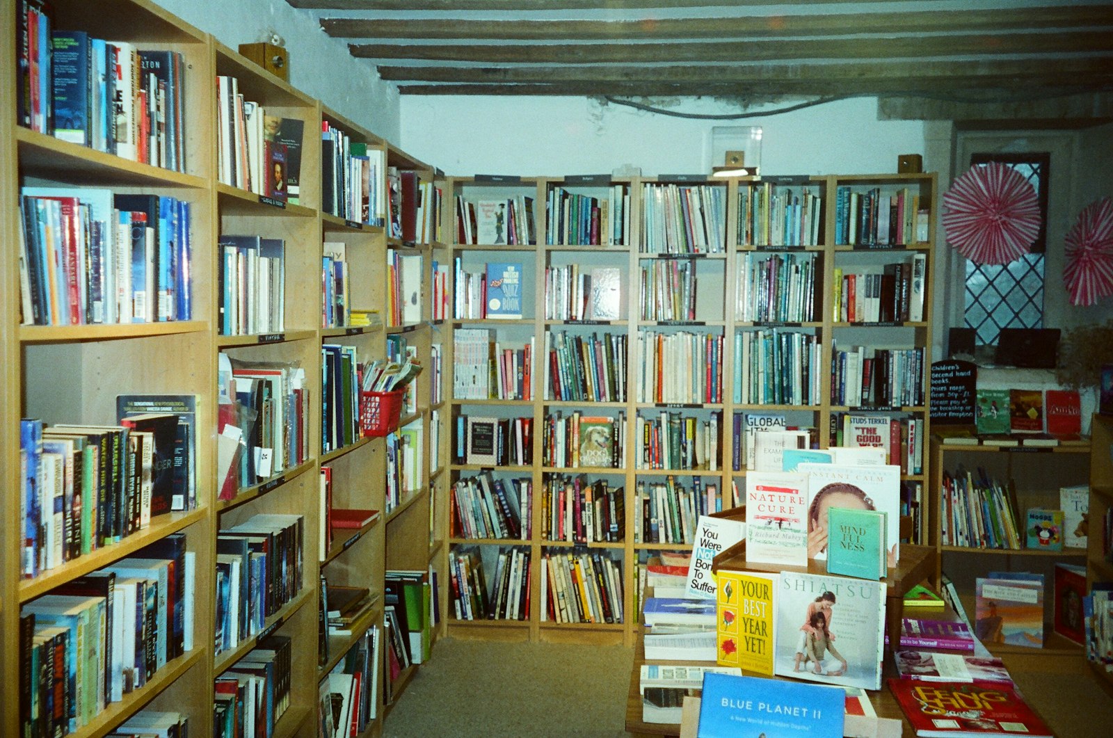Inside the shop, shelves of new and secondhand books
