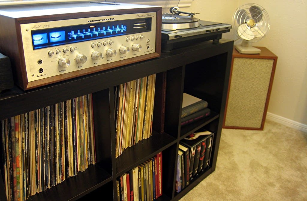 A receiver, a turntable and shelves of records